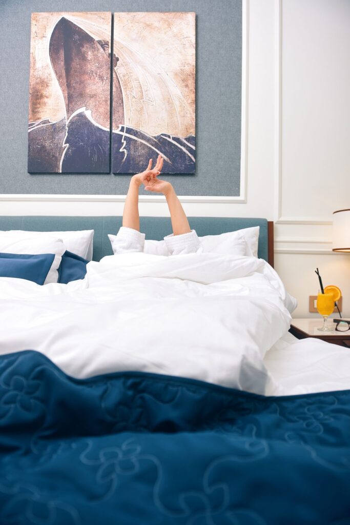Guest waking up in a hotel room, morning light through the window